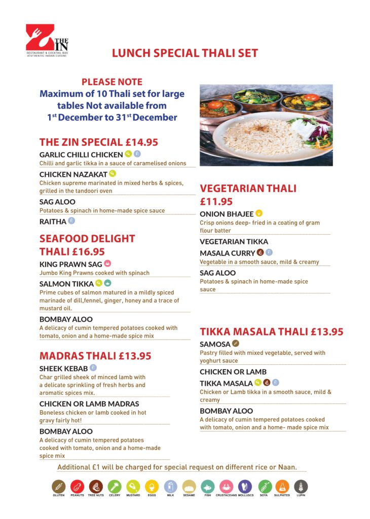 Delicious lunch special thali set menu featuring a variety of dishes.